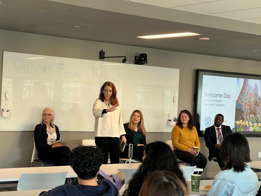 Close up: Program Director Regina LaBelle delivers opening remarks to prospective students.